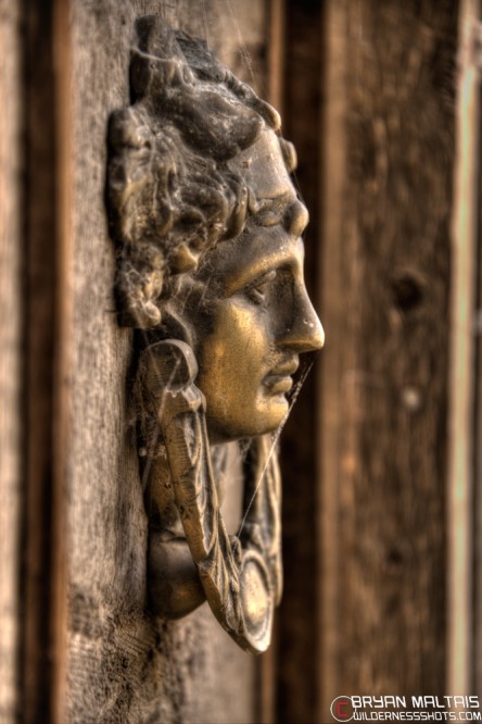 Creepy gothic door knockers may indicated a haunting