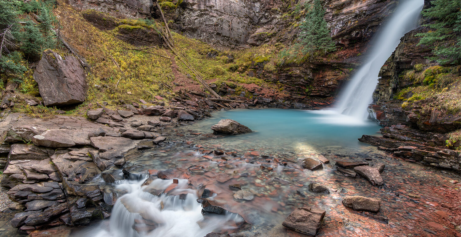 Aqua waterfall below colorado