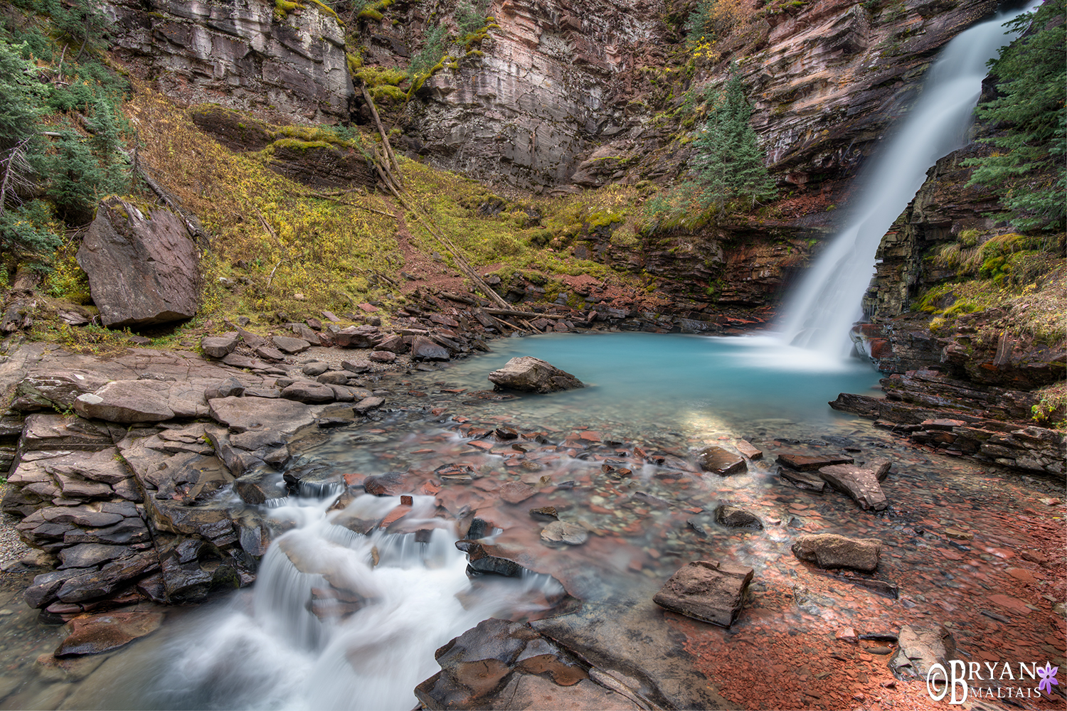 Aqua waterfall below colorado